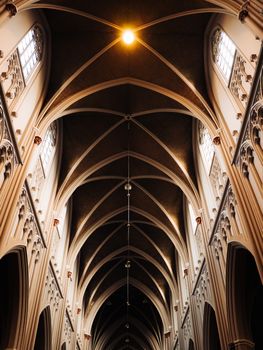Stunning view of a Gothic cathedral ceiling showcasing intricate arches and artistic design.
