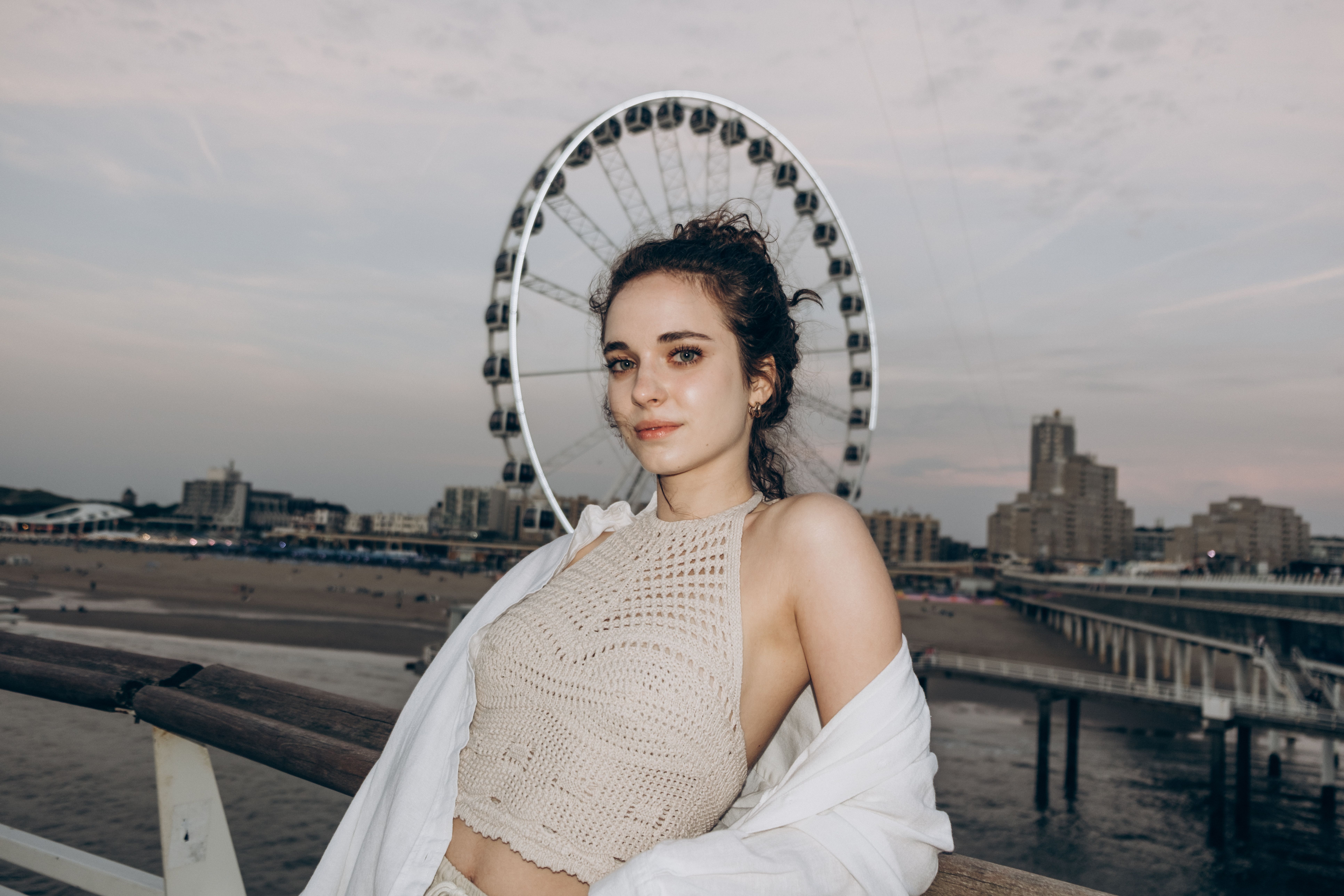 Portrait with Ferris Wheel in Coastal Urban Setting · Free Stock Photo