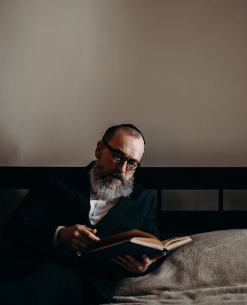 Free Bearded Man Reading a Book Stock Photo