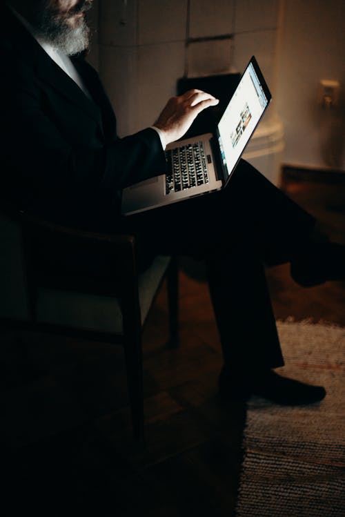 Free Photo Of Man Using Laptop Stock Photo