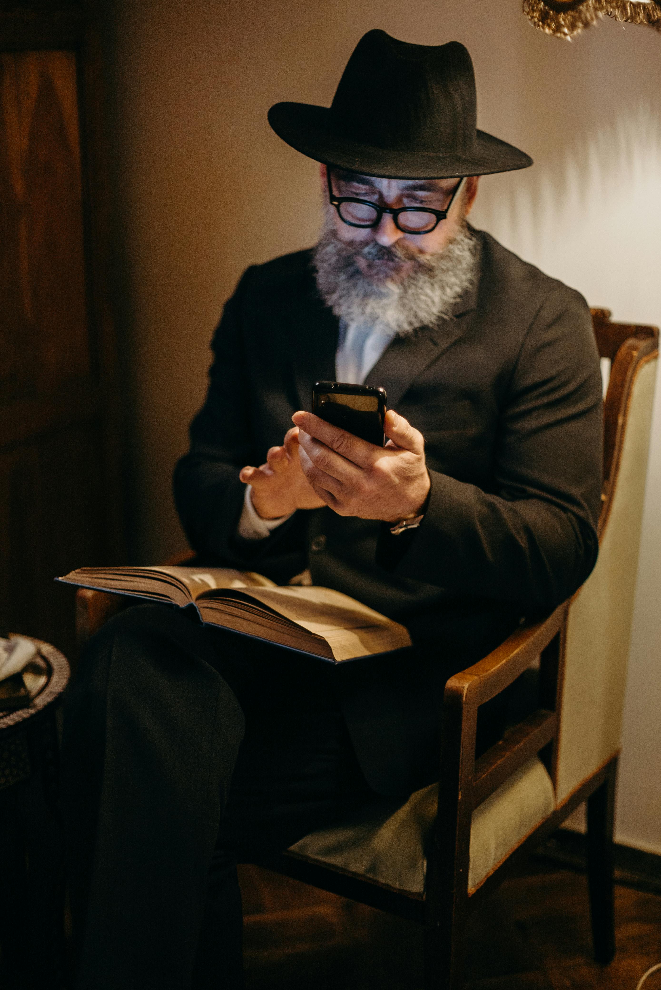 photo of man using mobile phone