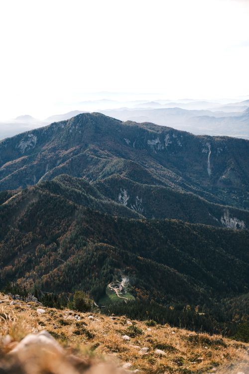 Free Captivating aerial view of a serene mountain range under a clear sky, showcasing natural beauty. Stock Photo