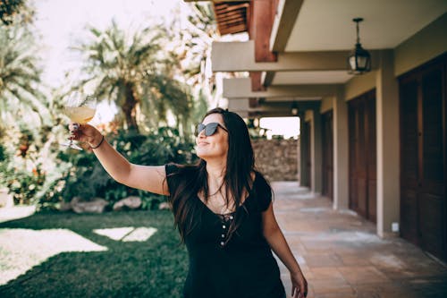 Free Photo Of Woman Holding Wine Glasses Stock Photo