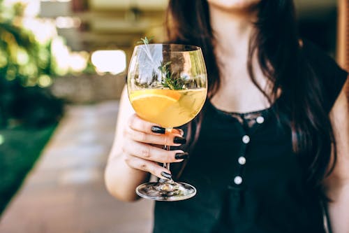 Photo Of Person Holding Wine Glass