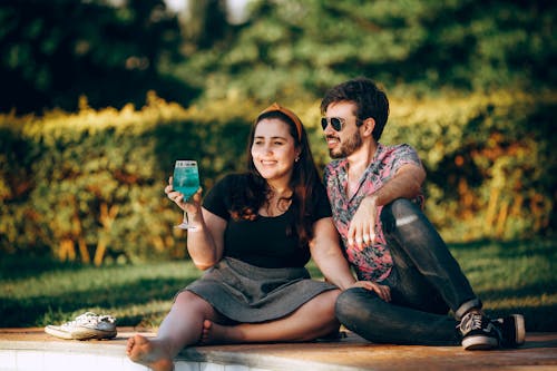 Photo Of People Sitting On Ground