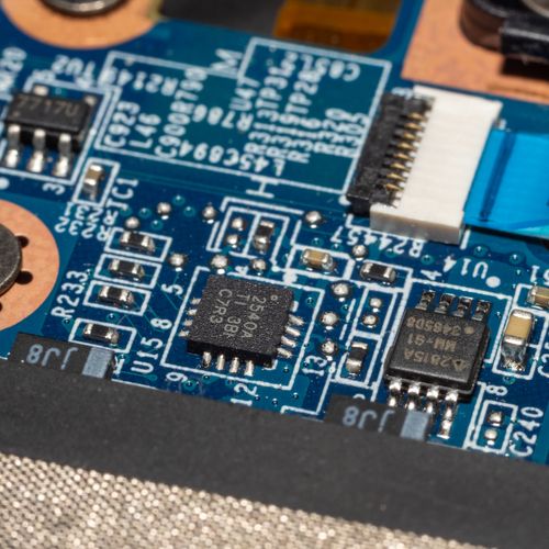 Free Macro photograph of a circuit board showing microchips and electronic components. Stock Photo
