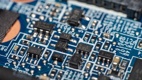 Free Detailed macro shot of electronic circuit board with chip and components. Stock Photo