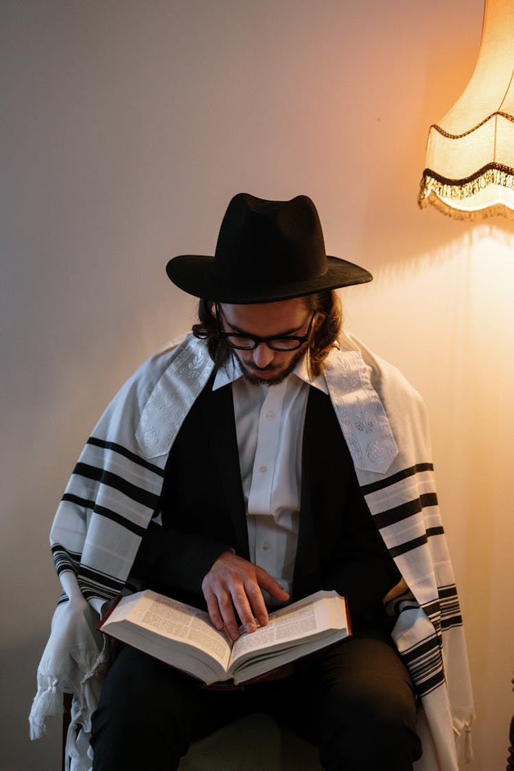 Young Man Reading A Book