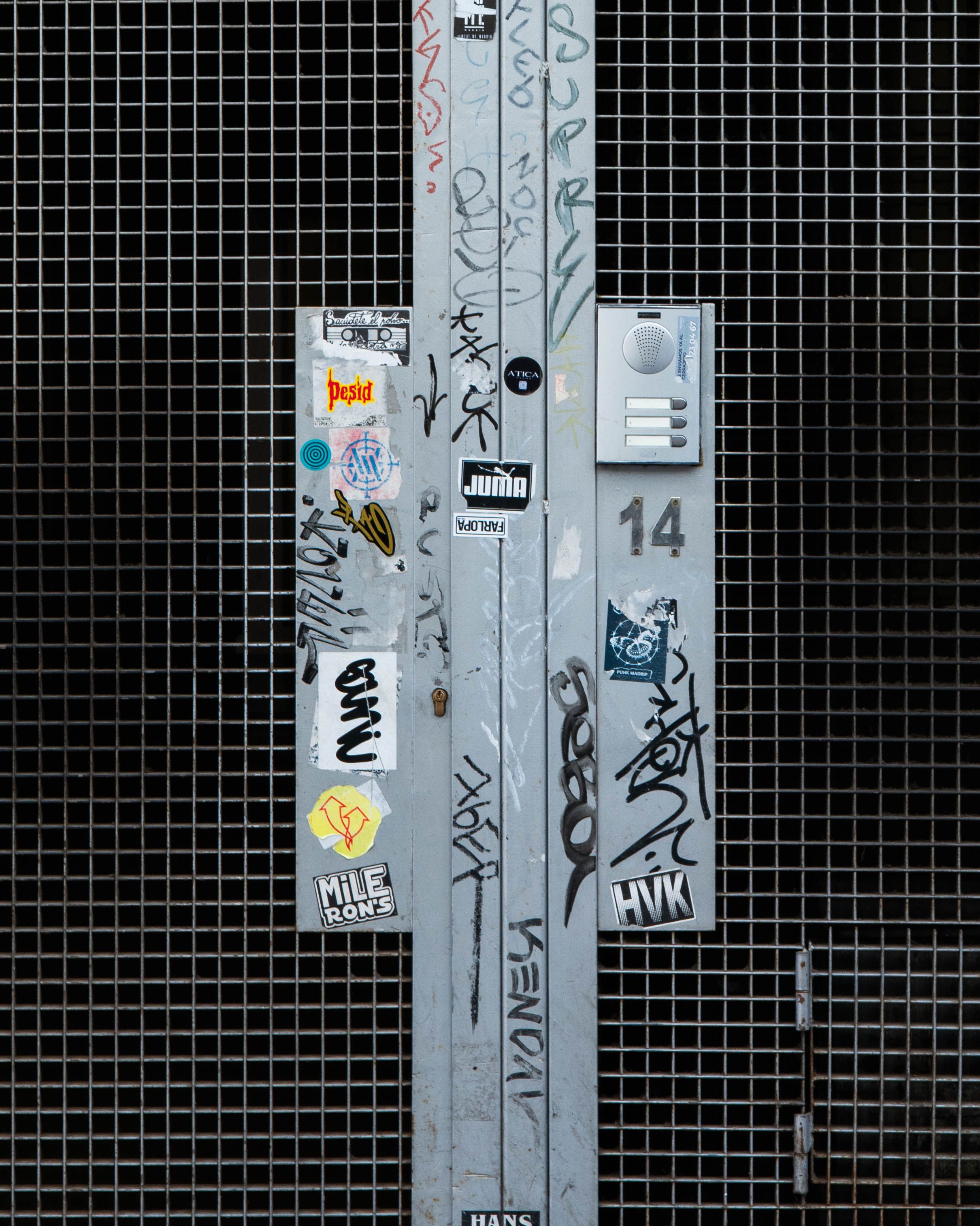 Urban Graffiti on Metal Door with Stickers · Free Stock Photo