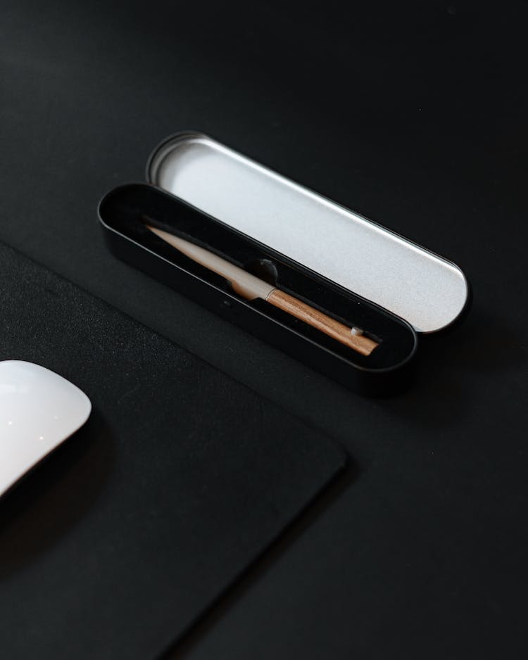 Small Black Case For Pencil On Black Surface