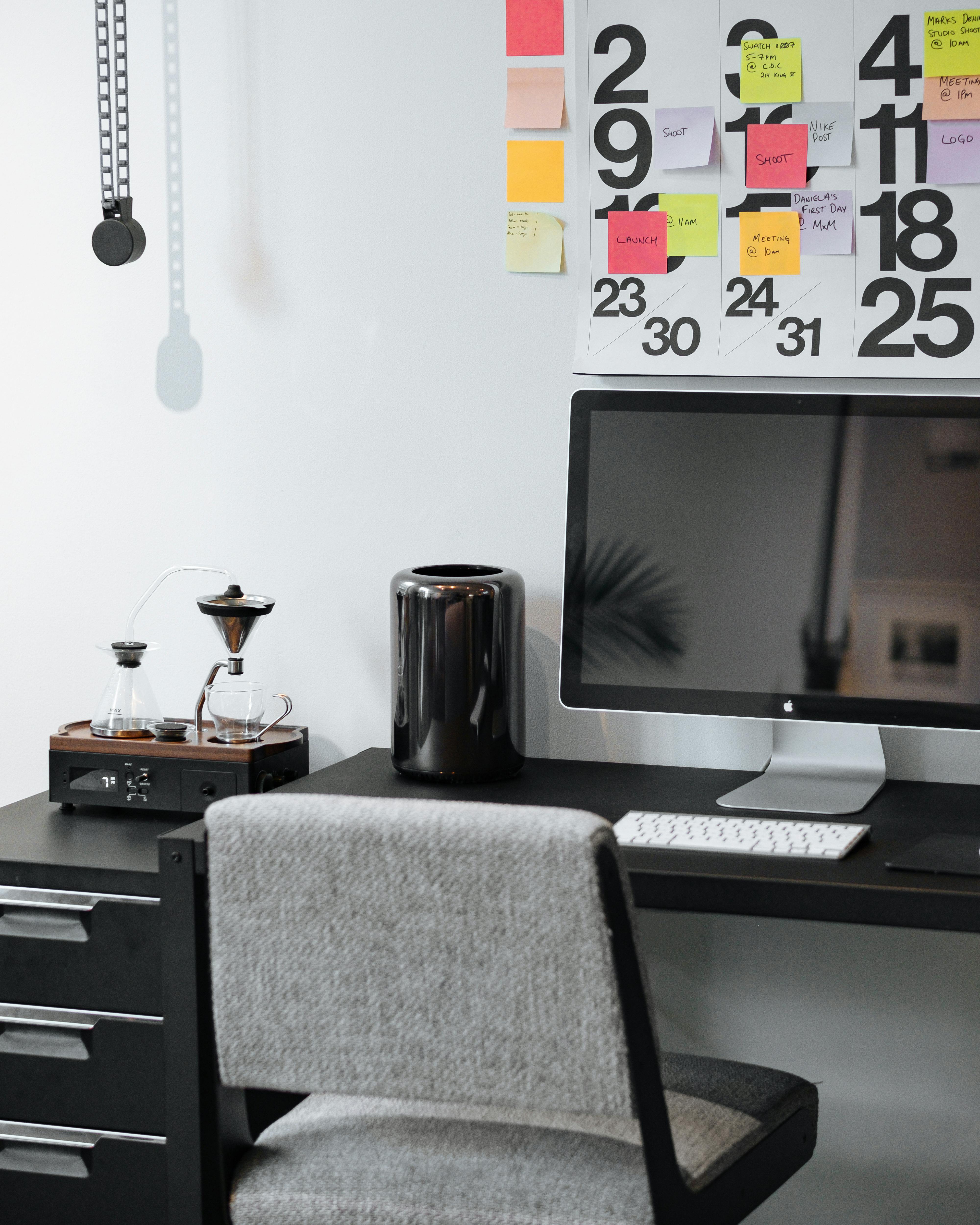 Silver Imac On Black Wooden Desk Free Stock Photo