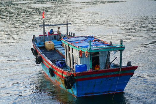 Traditional fishing boat floating in Da Nang, Vietnam waters, showcasing coastal life.