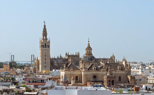 Free A beautiful aerial view of the iconic Seville Cathedral and Giralda Tower in Andalucía, Spain. Stock Photo