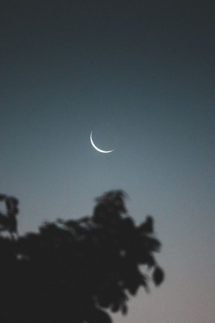 A tranquil night sky featuring a crescent moon over Armação dos Búzios, Brazil.