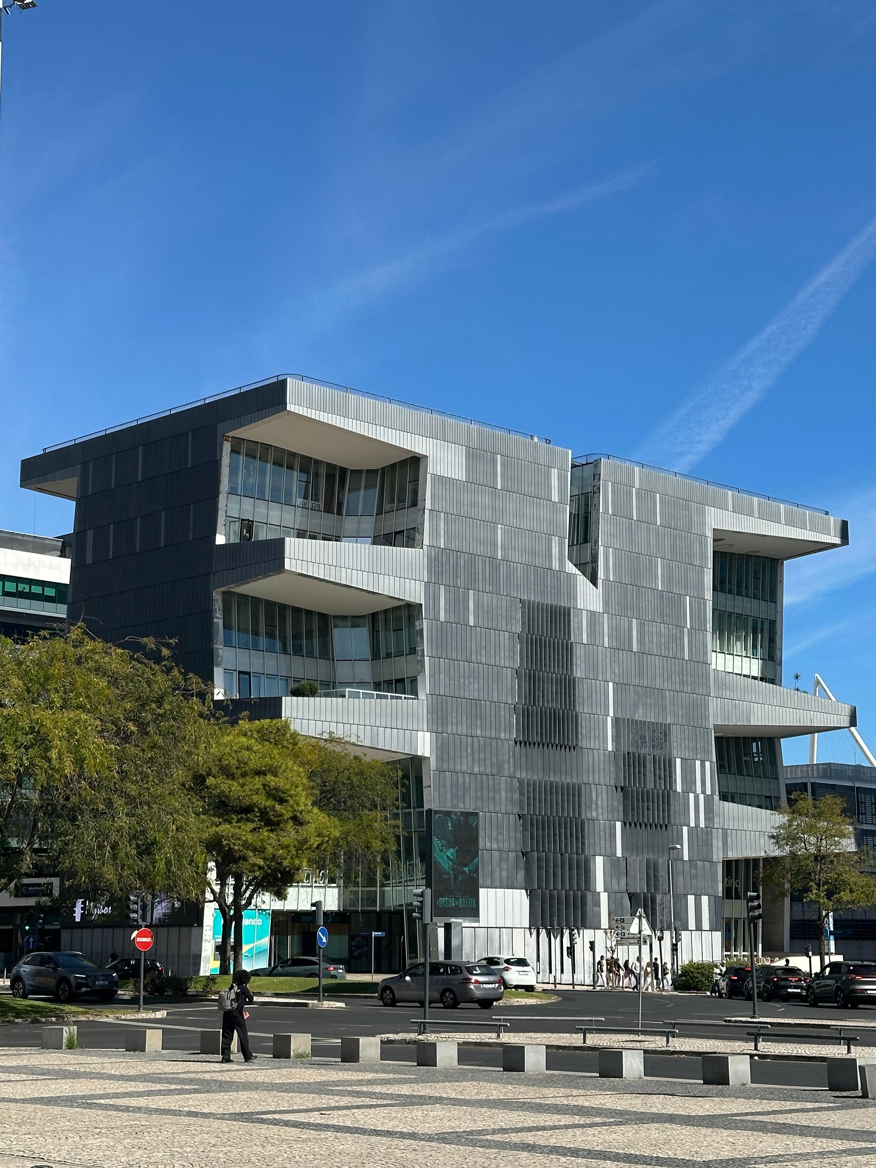 premium contemporary limestone and glass office building in Lisbon with landscaped entrance