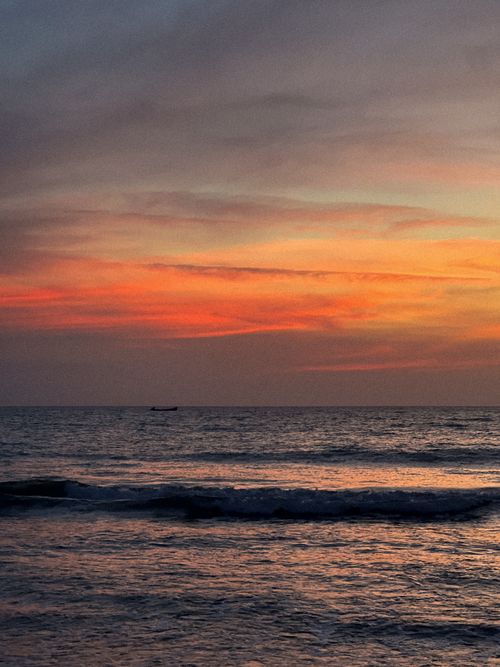 Free Breathtaking sunset view over the ocean in Cartagena, blending warm hues with tranquil waves. Stock Photo