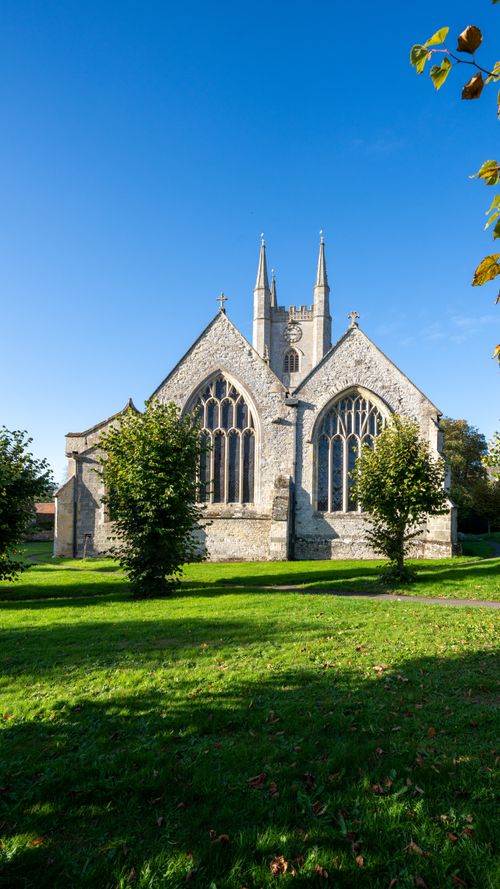 Free Historic Gothic church under a clear blue sky in Mere, England. Stock Photo