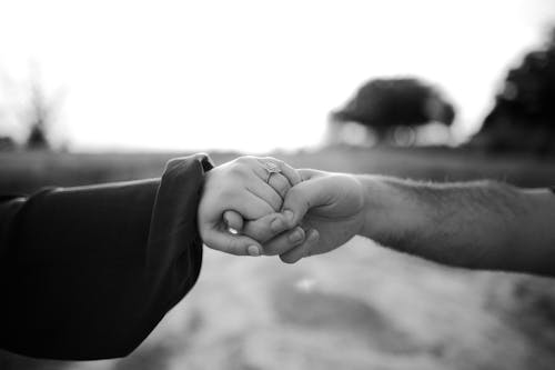 Photo Of People Holding Hands