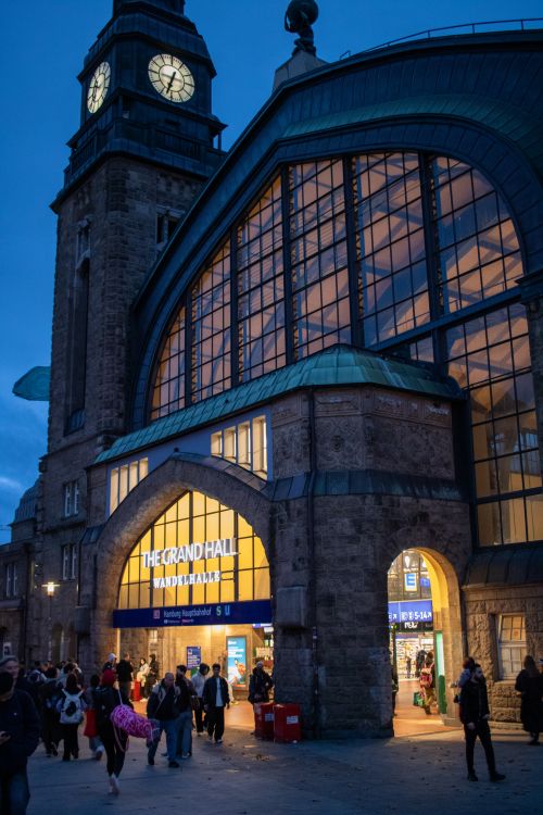 Free Night view of Hamburg Hauptbahnhof with people entering the station. Stock Photo