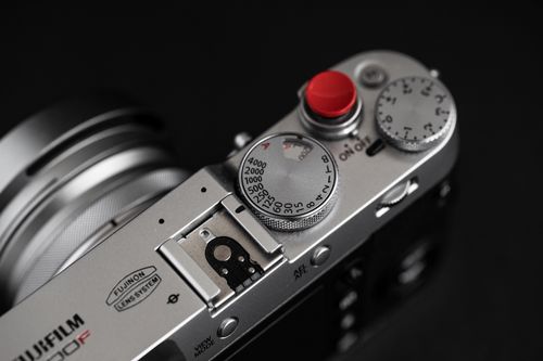 Free Detailed view of a vintage style camera's top, showcasing dials and buttons. Stock Photo