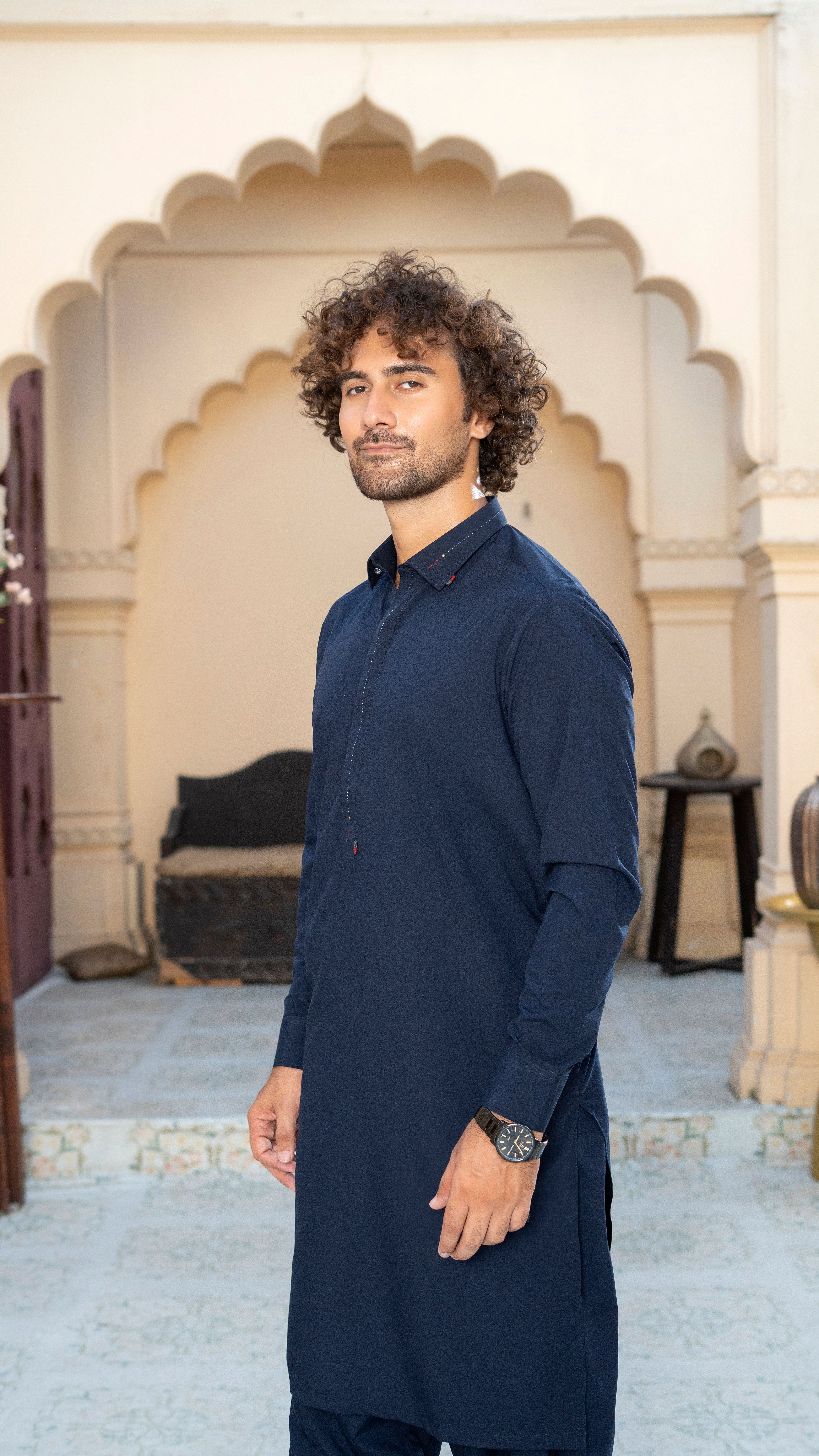 Man in Traditional Outfit at Heritage Building · Free Stock Photo