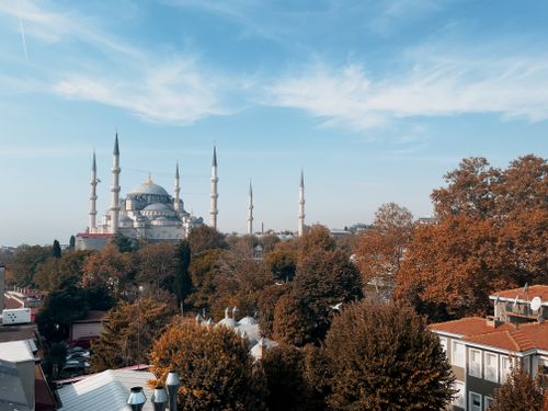 Free Aerial view of the iconic Blue Mosque surrounded by autumn foliage in Istanbul. Stock Photo