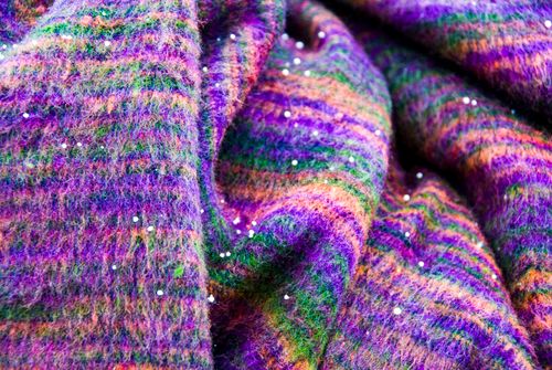 Free Close-up of vibrant multicolored wool fabric with delicate sparkles and textures. Stock Photo
