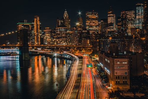 Free Breathtaking long exposure capture of New York City's vibrant skyline at night. Stock Photo