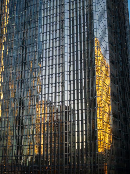 Free Golden hour reflections on skyscraper windows create a stunning urban view. Stock Photo