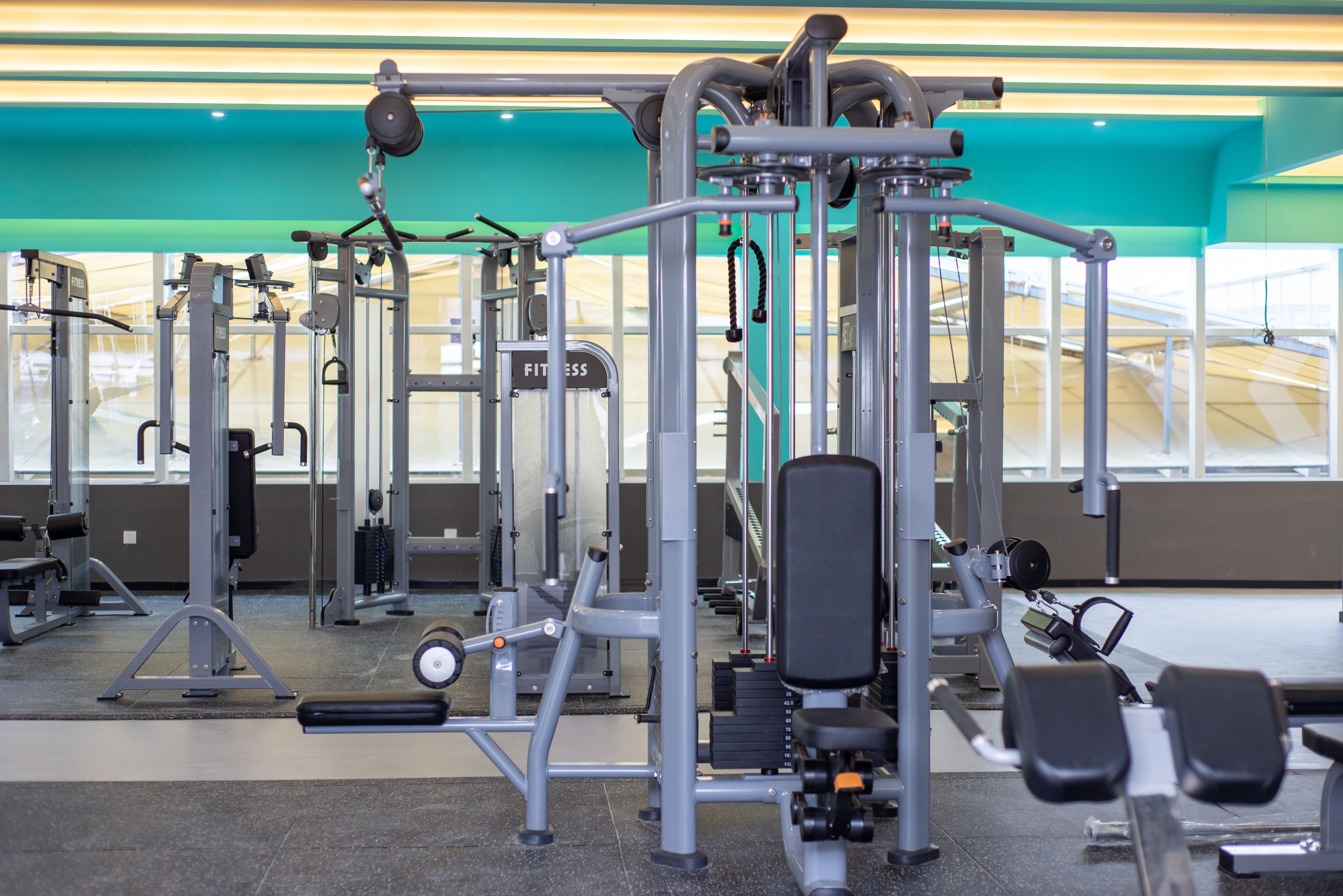 Stock photo: State-of-the-art gym machines in a brightly lit fitness studio, promoting active lifestyles