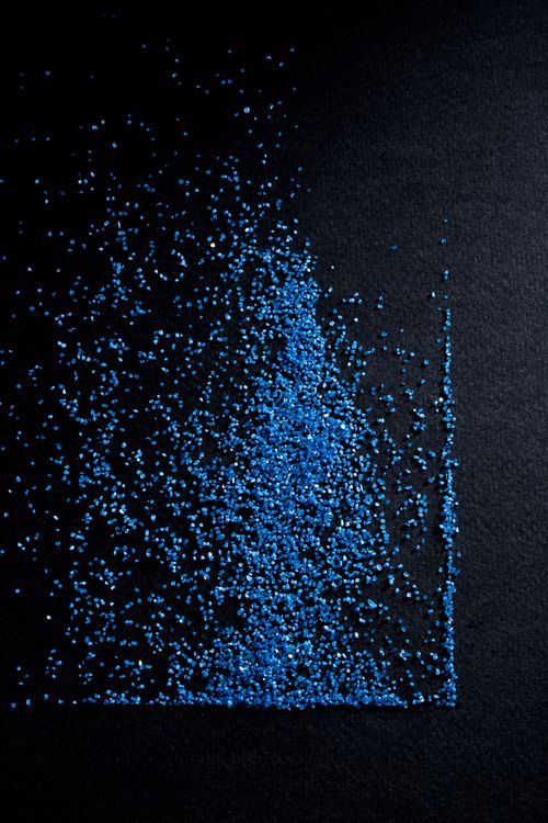 Free Abstract image of blue glitter sprinkled on a dark surface, creating an artistic texture with vivid contrast. Stock Photo