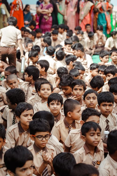 Free Group of children in school uniforms attending an outdoor assembly in Hyderabad, India. Stock Photo