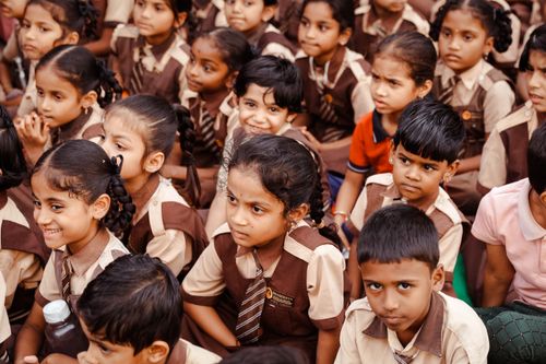 Free Group of Indian school children in uniform gathered outdoors in Hyderabad. Stock Photo