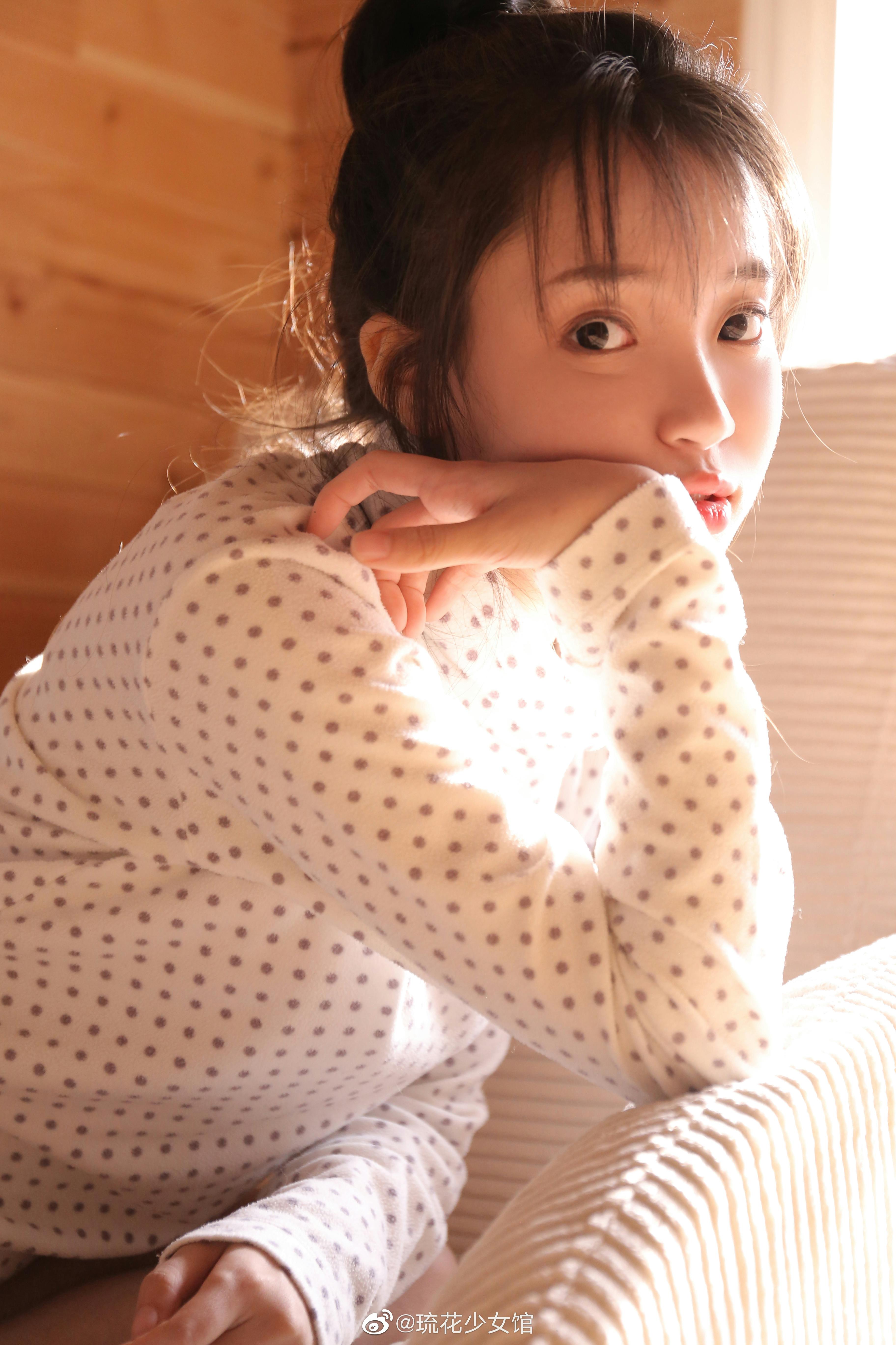 A person performing a light meditation or deep breathing exercise to prepare for sleep, emphasizing pre-sleep relaxation.