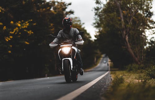 Photo Of Man Driving Motorcycle