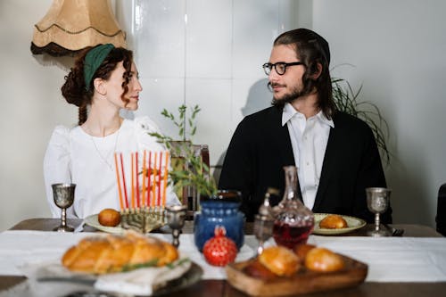 Free Young Couple Sitting at Table Stock Photo