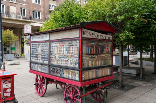Free Colorful street bookstore cart displaying books in Budapest, Hungary. Stock Photo