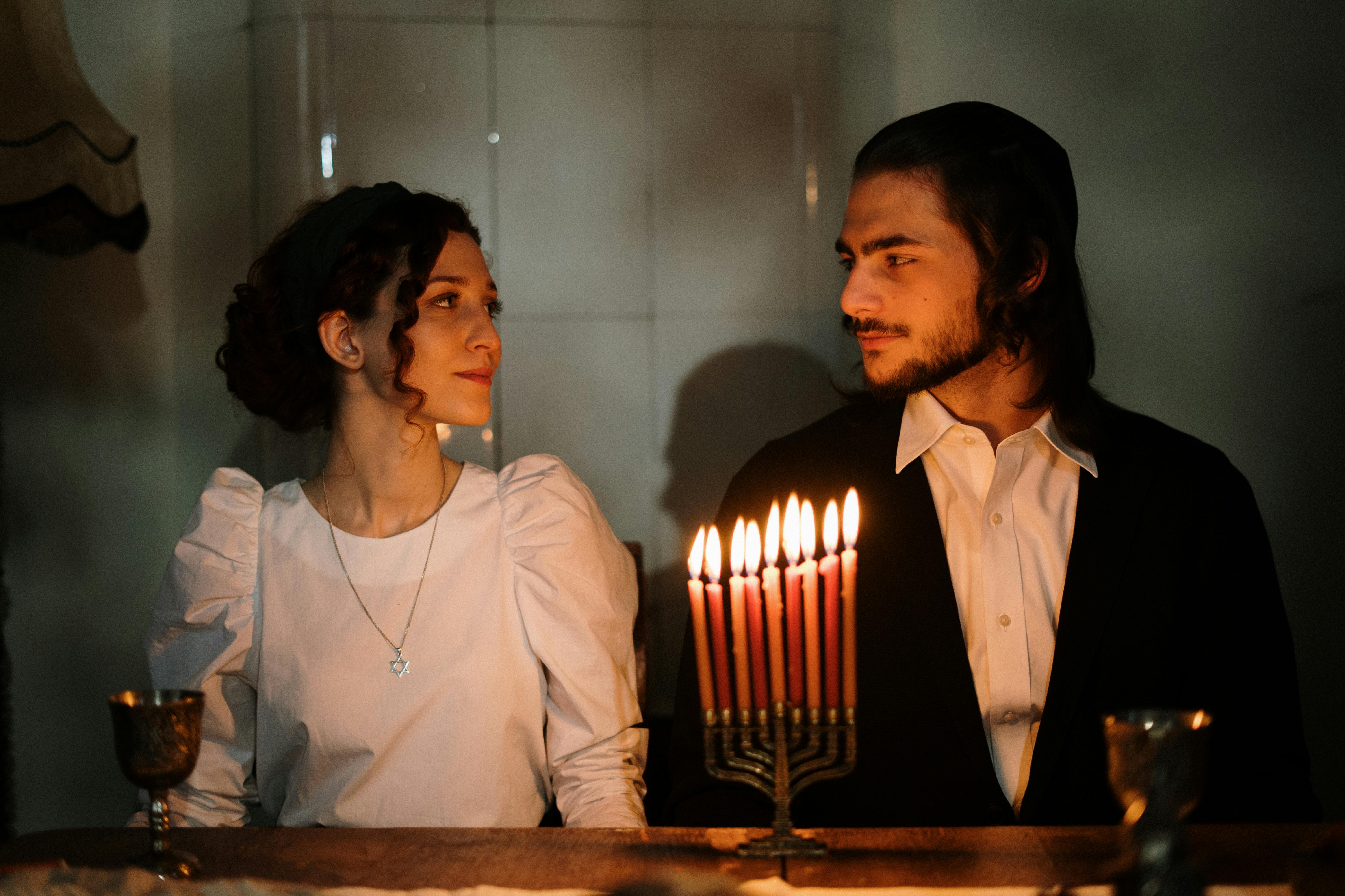 jewish couple with a menorah