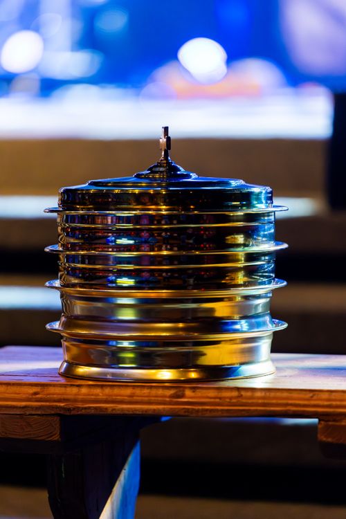 Free Close-up of stacked communion trays during a church service, symbolizing Christian communion. Stock Photo