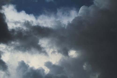 Free Dark, dramatic clouds dominate the sky, creating a moody atmosphere. Stock Photo