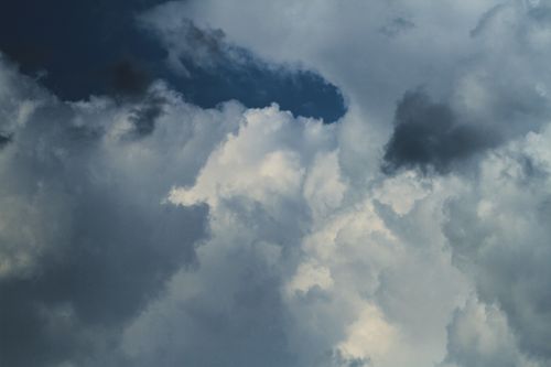 Free Captivating view of dramatic cumulus clouds against a deep blue sky. Stock Photo