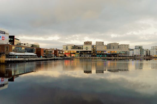 Free stock photo of city, water, cloudy, buildings