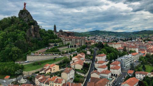 Free Aerial view of Puy-en-Velay, France with the notable Statue of Mary and picturesque townscape. Stock Photo