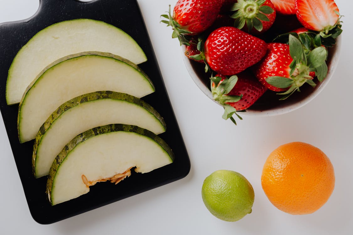 Photo Of Strawberry Beside Sliced Pumpkin