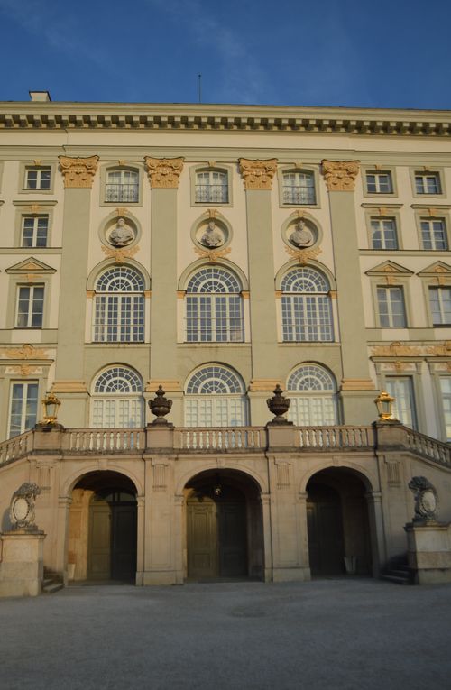 Free Stunning baroque architecture with ornate details and grand windows at sunset. Stock Photo