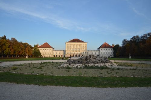 Free The Nymphenburg Palace in Munich surrounded by gardens at sunset. Stock Photo