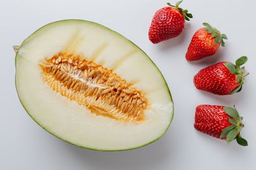 Free Photo Of Melon Near Strawberries Stock Photo