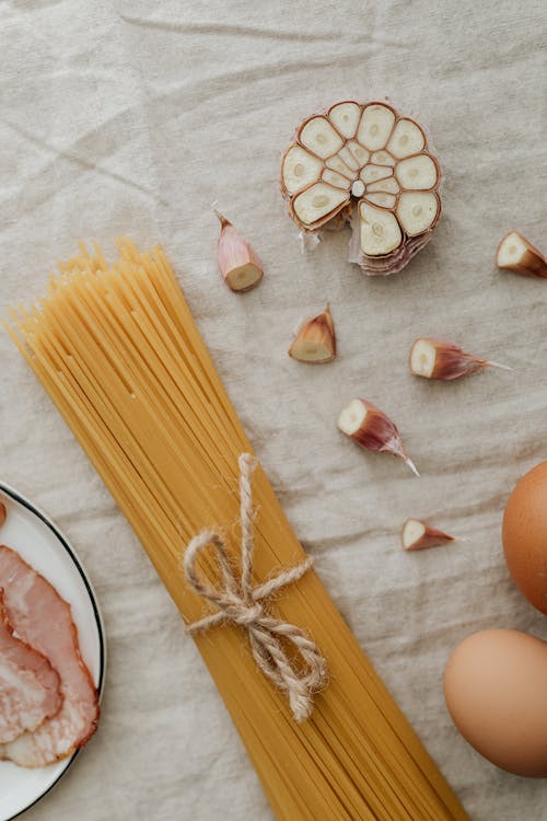 Photo Of Sliced Garlic Near Pasta