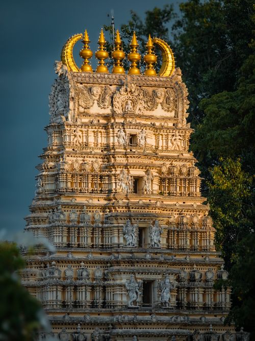Free Stunning view of a detailed temple tower in Vajamangala, India, beautifully lit by the sunset. Stock Photo