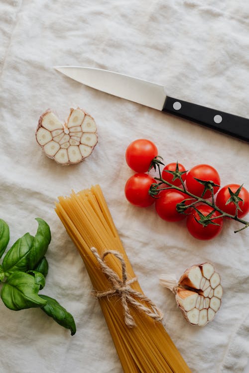 Photo Of Pasta Beside Cherry Tomatoes